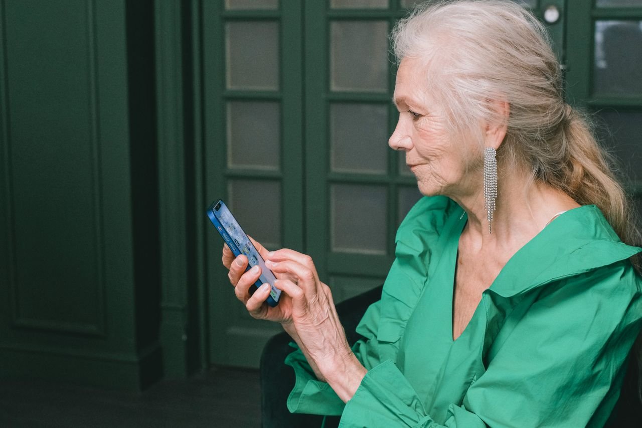 A person using Just Pass Go on their phone